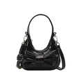 Glossy black mini handbag featuring a large bow accent and silver metal hardware - Black