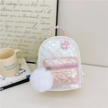 Quilted mini backpack with pink pearl handle, fur ball charm, and floral decoration - White