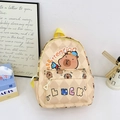 Beige kids backpack featuring cute capybara print and stylish diamond quilt pattern - Beige