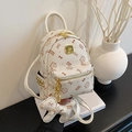 Mini cream backpack with brown cat and bow prints, faux leather finish with gold rivets - Bare Bag / Off White