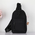 Minimalist black nylon chest bag for kids with adjustable strap and dual zippers - Large / Black