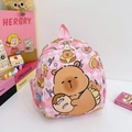 Pink checkered kids backpack featuring a cute cartoon bear holding a donut - Pink