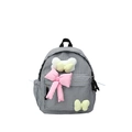 Kids black and white plaid backpack with cute pink and yellow bow accents - Small / Black