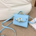 Mini light blue lychee pattern crossbody bag for children with golden metal clasp - Blue