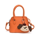 Mini orange leather handbag for girls with a cute cartoon dog plush charm and strap - Orange (With Pendant)