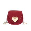 Kids mini crossbody bag in red pebble leather featuring a gold heart clasp and chain - Red