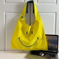 Gele canvas draagtas voor kinderen met blauwe smiley-opdruk en schouderband - Geel Groot