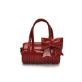 Mini red cylinder bag for girls featuring a large decorative bow and glossy finish - Red