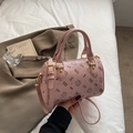 Pink Boston bag with cute cat prints and golden hardware in a lifestyle setting - Large Without Pendant / Purple