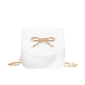 White mini chain crossbody bag for girls with golden metallic bow and pearl accents - Off-white