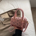 Pink Boston bag with cat print and round handles, shown in a lifestyle scene setting - Small Without Pendant / Pink