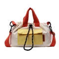 Chic drawstring bucket bag in creamy white with vibrant orange handles and yellow pocket - Off White