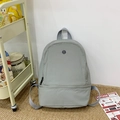 Minimalist grey large capacity children backpack with circular logo for school and daily use - Gray