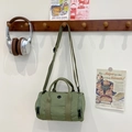 Kid's stylish light green barrel crossbody bag with adjustable strap and handles - Dark Green