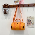 Kids orange canvas cylinder duffel bag with crossbody strap and top handles - Orange