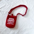 Red canvas crossbody bag for kids featuring bold white letter printing and adjustable strap - Red