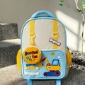 Close-up of kids cartoon excavator backpack in blue and yellow on outdoor steps - Blue