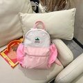 Pink and beige contrast color kids backpack on sofa with a round landscape logo - Small / Pink