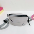 Light grey sporty chest bag for kids featuring black KAYINAI letter print and strap - Gray
