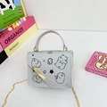 Mini crossbody bag for kids featuring a cute hippo print and golden chain strap - Silver