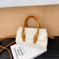 Chic cream-colored textured leather toddler handbag with brown handles and gold buckle - White
