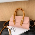 Pink lychee grain leather handbag for girls with round brown handle and gold buckle - Pink
