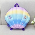 Detailed macro view of seashell shaped rainbow backpack with iridescent star patches and dots - Purple