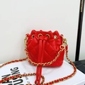 Fashionable red quilted leather bucket bag for kids with gold chain strap and drawstring closure - Red