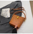 Brown bucket bag with cute bear print and golden clasp on grey suit background - Bare Bag / Brown