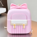 Detail of pink hardshell kid's backpack featuring large bow and waterproof EVA texture - Pink