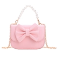 Pink kids handbag with large bow, pearl handle and gold chain strap on white background - Pink