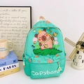 Water green kids backpack featuring a cartoon capybara riding a crocodile print - Green