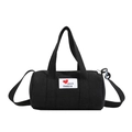 Black canvas bucket bag for kids featuring a red heart patch and adjustable shoulder strap - Black