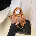 Mini pink Boston bag in pebble leather with top handles and a cute plush bear charm - With Pendant / Pink