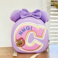 Detail of purple hardshell kids backpack with plush bow and cute 3D bear emblem - Purple
