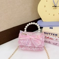 Pink children handbag with pearl handle, bow detail and sequins on a dreamy background - Pink Letter Bowknot