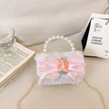 Pink sequin girls crossbody bag with cute princess bow and pearl handle detail - White