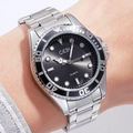 Silver quartz watch for men with black textured dial and rotating bezel on wrist - Silver Case Black Dial