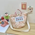 Detailed shot of quilted floral cotton bag with Bigstar embroidery and button closure - Pink