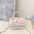 Pink floral girl's mini handbag with pearl handle and decorative charm chain - White Flower