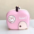 Detailed front view of a pink hard shell kids backpack featuring a cute 3D bunny character - Rose Pink