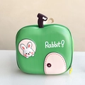 Detail view of green apple-shaped kids backpack with cute cartoon rabbit print - Green