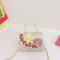 Pink lavender girl's crossbody purse with floral embroidery, pearls, and a golden chain - Pink