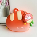 Detail of cute carrot shaped hardshell backpack for kids with a small bunny coin purse - Orange