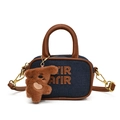 Mini navy denim kids crossbody bag with brown leather handles and a plush bear charm - Denim with Pendant