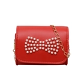 Red mini crossbody bag for girls with pearl bow ornament and elegant gold chain strap - Red