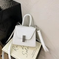 White minimalist crossbody mini bag with crosshatch leather and silver rotating clasp - White