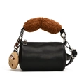 Mini bolso cilíndrico negro con asas de felpa marrón y detalle de dije de galleta - Negro