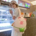 Pink cartoon capybara backpack with green turtle pendant and side pocket shown on model - Without Pendant / Light Pink