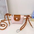 Mini crossbody bag for kids with pink lychee PU body and brown rope shoulder strap - Pink
